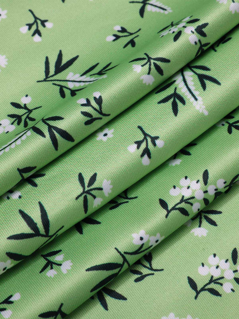 Green 1940s V-Neck Ditsy Floral Dress — the kind of 1940s dress that makes strangers smile