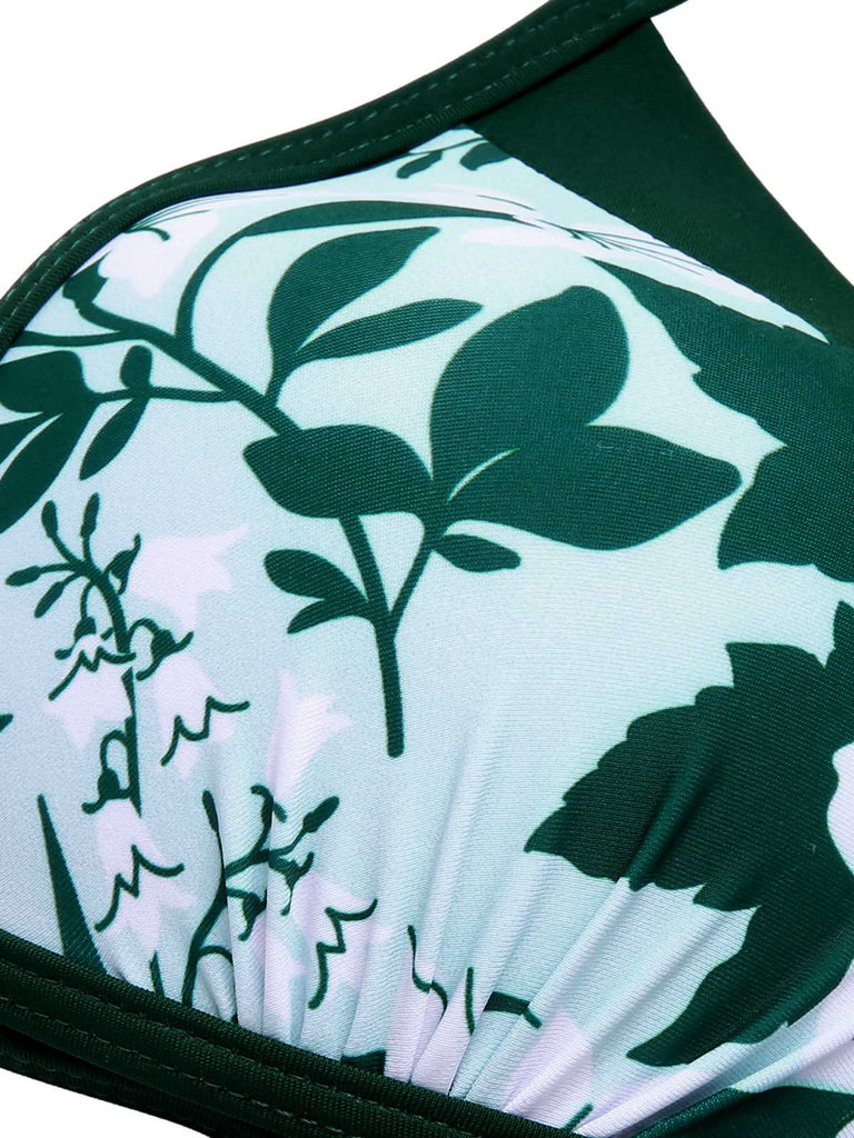 She's wearing Green 1950s Halter Plants Print Swimsuit & Cover-Up and the whole beach remembers the 1950s