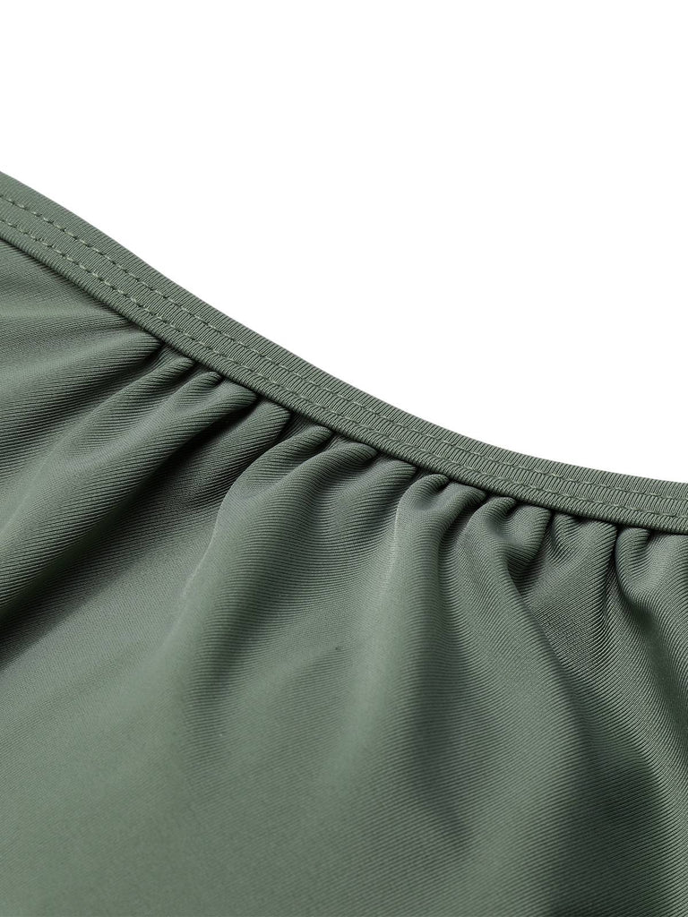 She's wearing Green Grey 1930s Halter Strappy Tankini Swimsuit and the whole beach remembers the 1930s