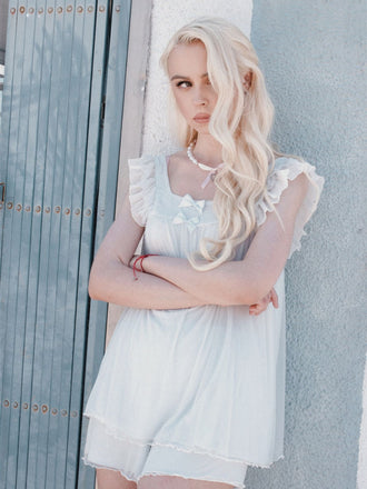 She finds her 1950s story in this Light Blue 1950s Square Collar Pajamas