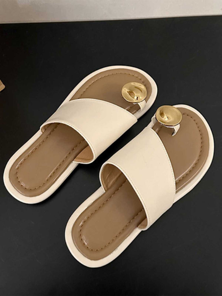 This Metal Thumb-Toe Beach Sandals carries vintage vacation dreams in every stitch