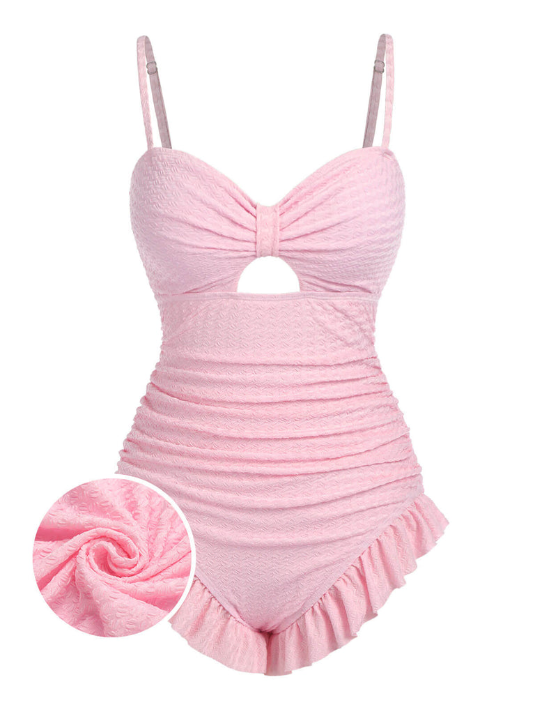 She's wearing Pale 1950s Solid Ruched Swimsuit and the whole beach remembers the 1950s