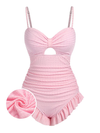 She's wearing Pale 1950s Solid Ruched Swimsuit and the whole beach remembers the 1950s