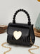 This Patent Leather LOVE Handle Mini Handbag carries vintage stories waiting to be told