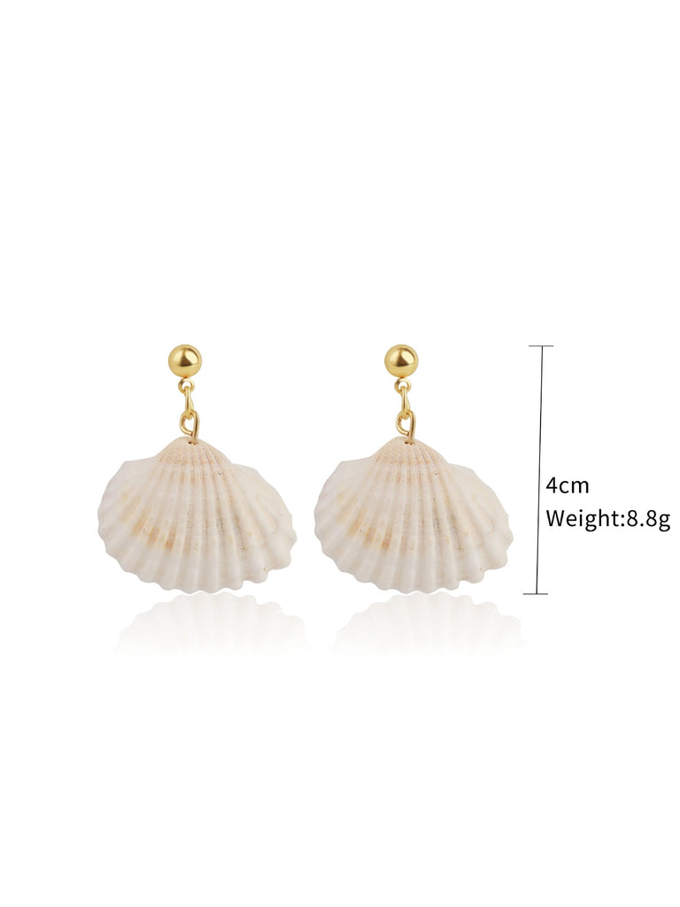 She adds this Mermaid Tail Seashell Dangle Earrings and suddenly it's vintage perfection