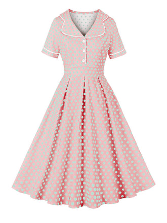 She slips into this Pink 1950s Blue Polka Dot Lapel Dress and suddenly it's a 1950s daydream