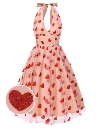 She slips into this Pink 1950s Halter Heart Mesh Dress and suddenly it's a 1950s daydream