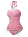 This Pink 1950s Halter Pleated Solid One-Piece Swimsuit carries 1950s vacation dreams in every stitch