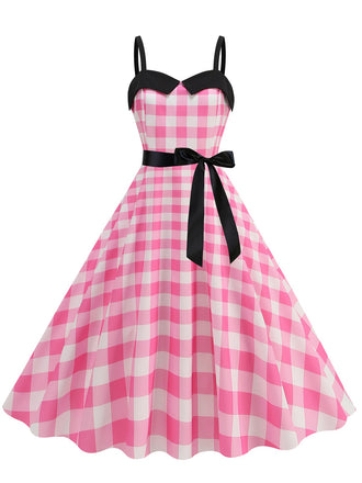 She slips into this Pink 1950s Plaid Patchwork Spaghetti Straps Dress and suddenly it's a 1950s daydream