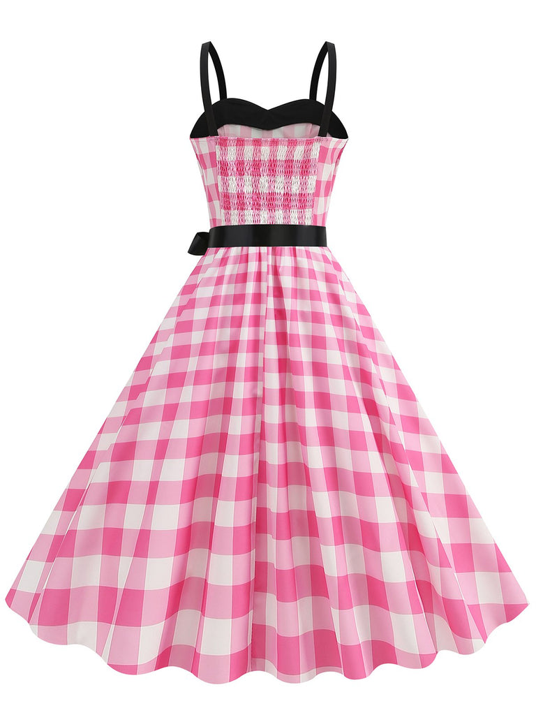 This Pink 1950s Plaid Patchwork Spaghetti Straps Dress wraps her in 1950s elegance, one twirl at a time