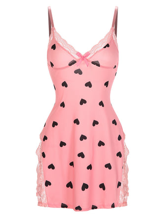 She slips into this Pink 1950s Spaghetti Straps Lace Hearts Nightgown and suddenly it's a 1950s daydream