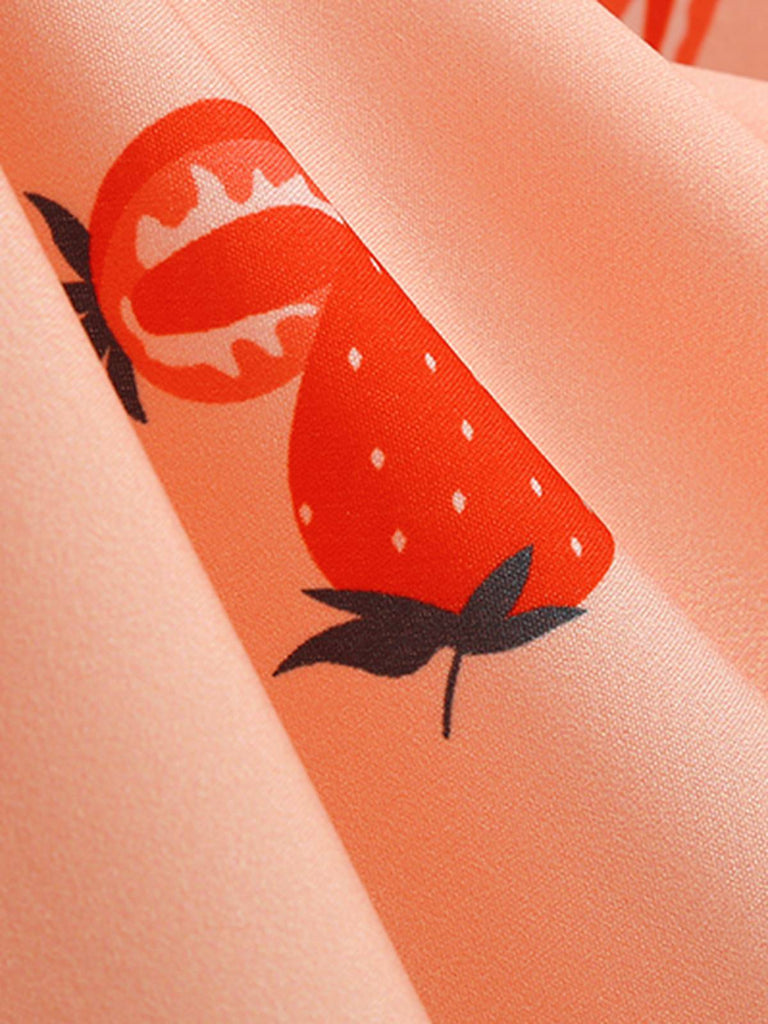 This Pink 1950s Strawberry Sleeveless Swing Dress wraps her in 1950s elegance, one twirl at a time