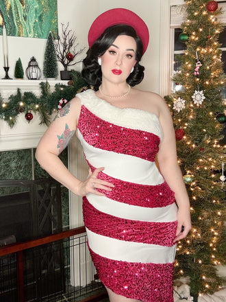 She slips into this Pink 1960s Candy Cane One-Shoulder Dress and suddenly it's a 1960s daydream