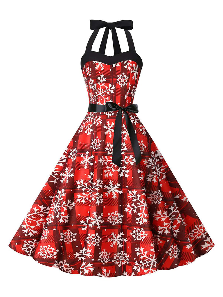 She slips into this Red 1950s Christmas Snowflake Halter Swing Dress and suddenly it's a 1950s daydream