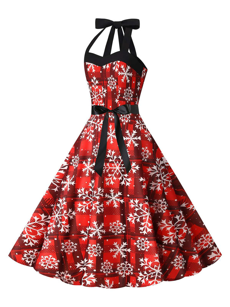 This Red 1950s Christmas Snowflake Halter Swing Dress wraps her in 1950s elegance, one twirl at a time