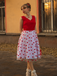 She slips into this Red 1950s Heart Bow Sleeveless Dress and suddenly it's a 1950s daydream