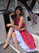 She slips into this Red 1950s Polka Dot Halter Dress and suddenly it's a 1950s daydream