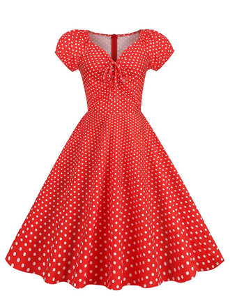 She slips into this Red 1950s Polka Dot Sweetheart Neck Bow Dress and suddenly it's a 1950s daydream