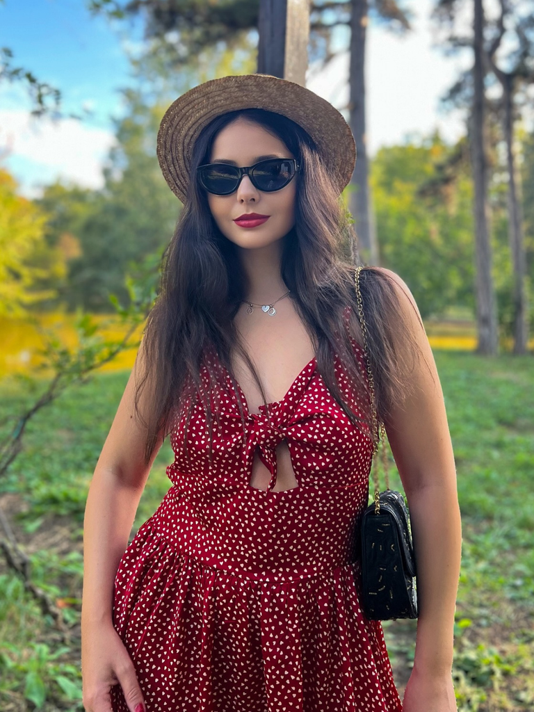 She slips into this Red 1950s Spaghetti Strap Heart Print Dress and suddenly it's a 1950s daydream