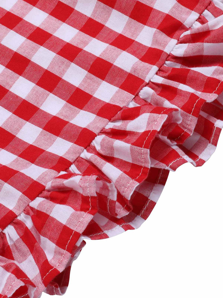 She finds her 1950s story in this Red 1950s Strawberry Plaid Suspender Romper