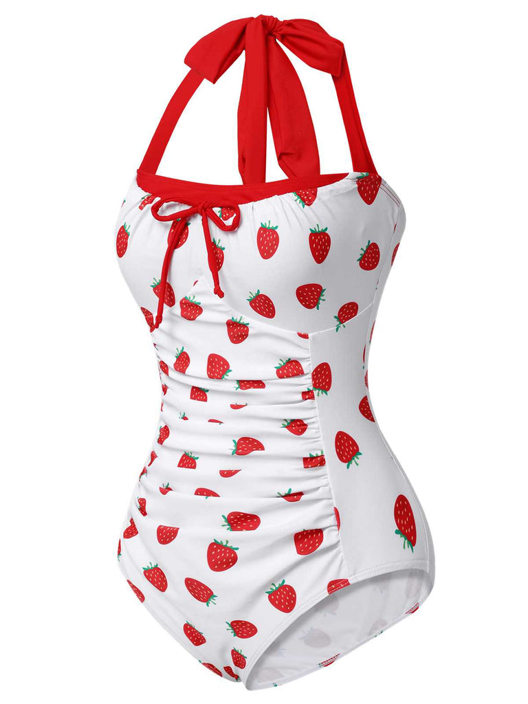 This Red 1960s Halter Bow Strawberry One-Piece Swimsuit carries 1960s vacation dreams in every stitch
