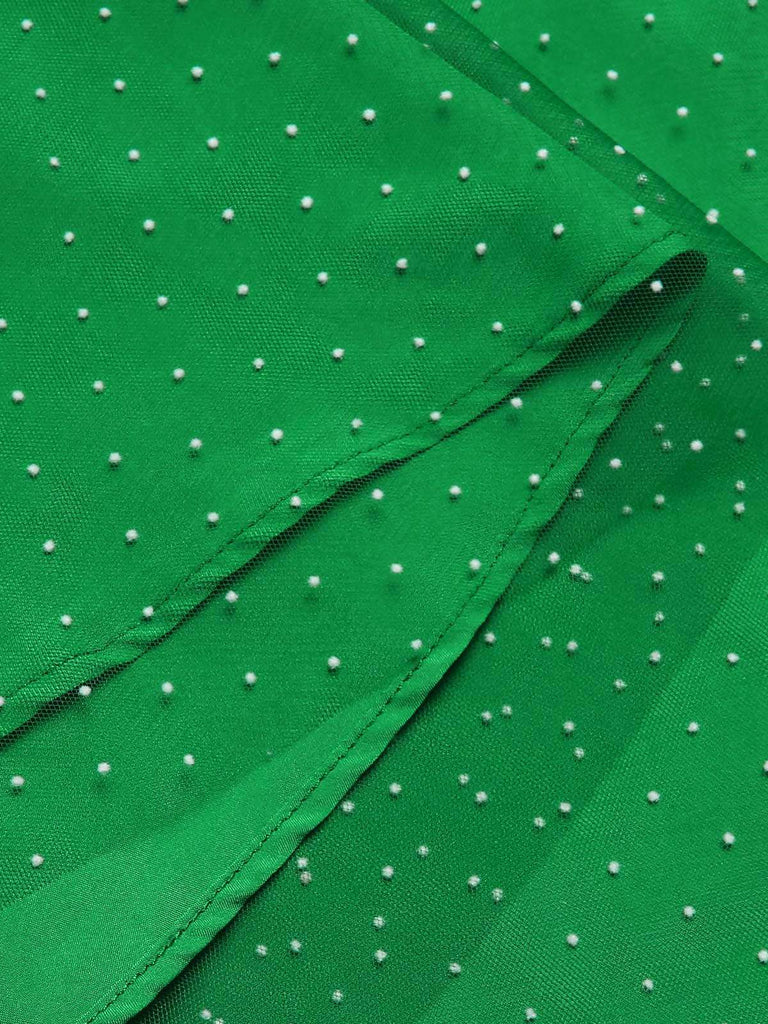 This Red & Green 1950s Christmas Polka Dots Dress wraps her in 1950s elegance, one twirl at a time