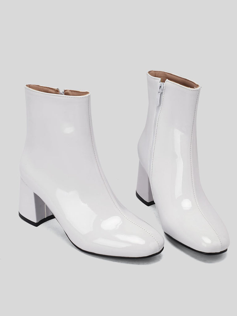 This Retro Christmas Patent Leather Block Heel Ankle Boots whispers 1950s secrets to those who notice