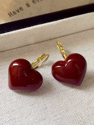 She adds this Retro Red 3D Heart Earrings and suddenly it's 1950s perfection