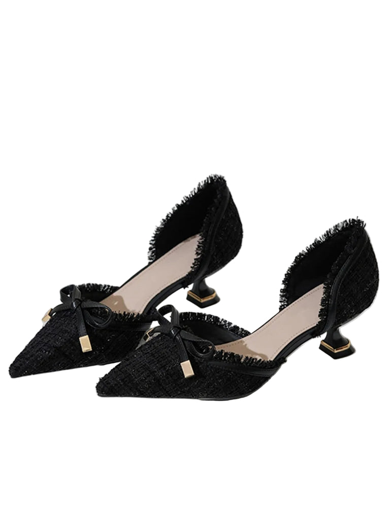 She finds her 1950s story in this Retro Tweed Bow Kitten Pointed Heels