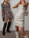 This Silver 1970s Bandeau Sequin Pencil Dress wraps her in 1970s elegance, one twirl at a time