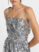 This Silver 1970s Spaghetti Straps Sequined Tutu Dress wraps her in 1970s elegance, one twirl at a time