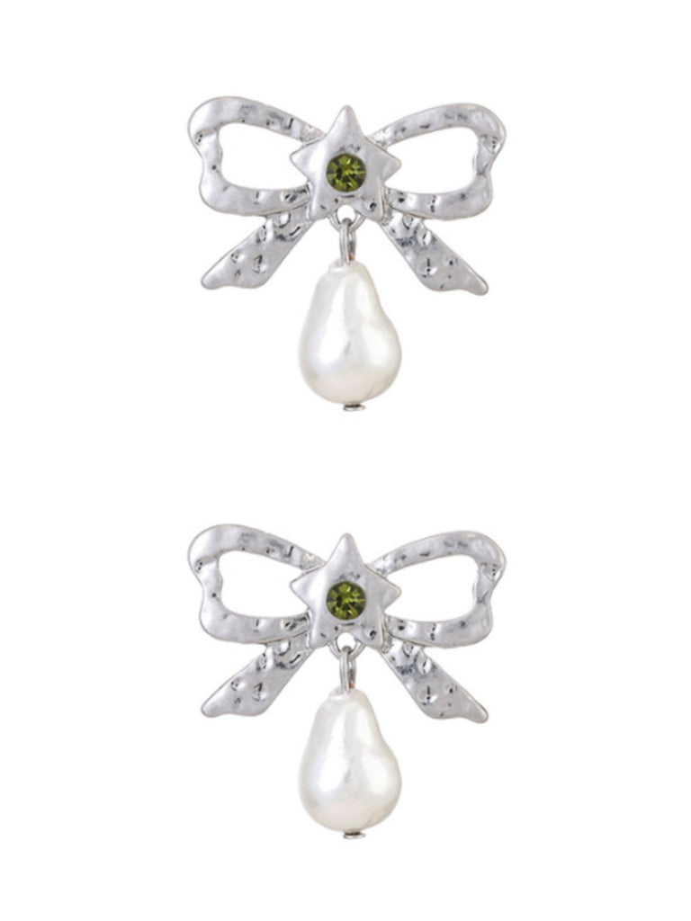 She adds this Silver Bow Star Pearl Drop Earrings and suddenly it's vintage perfection
