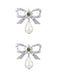 She adds this Silver Bow Star Pearl Drop Earrings and suddenly it's vintage perfection