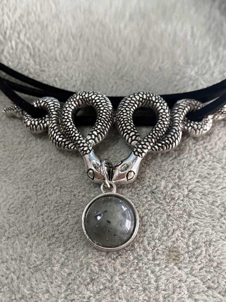 She adds this Silver Twin Snakes Halloween Necklace and suddenly it's vintage perfection