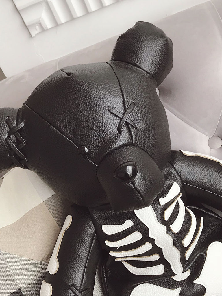 She finds her vintage story in this Skull Violent Teddy Bear Backpack