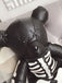 She finds her vintage story in this Skull Violent Teddy Bear Backpack