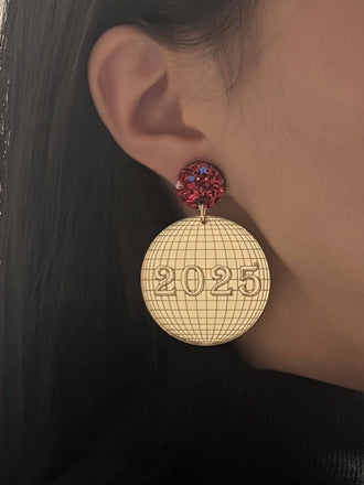 She adds this Sparkling 2025 Glitter Disco Earrings and suddenly it's vintage perfection