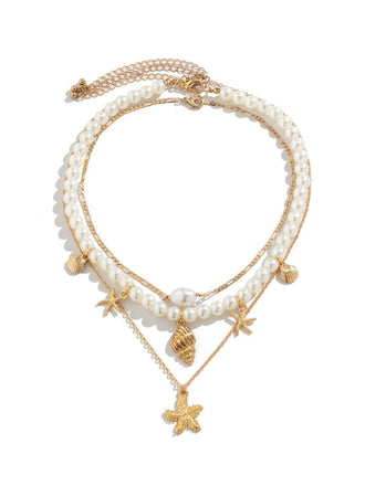 She adds this Starfish Seashell Pearl Layered Chain Necklace and suddenly it's vintage perfection