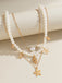 This Starfish Seashell Pearl Layered Chain Necklace carries vintage stories waiting to be told