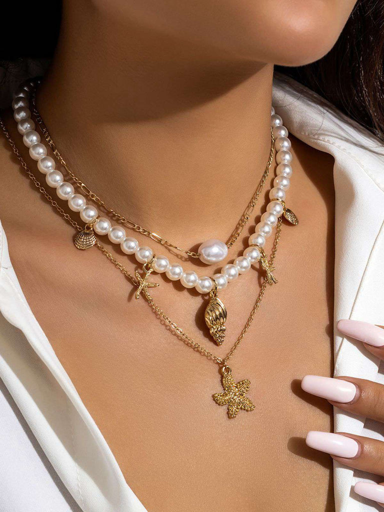 She adds this Starfish Seashell Pearl Layered Chain Necklace and suddenly it's vintage perfection