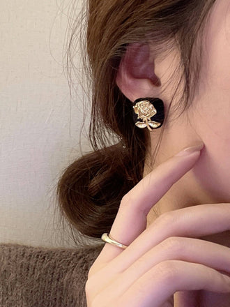 She adds this Vintage Black & Gold Cubic Flower Earrings and suddenly it's 1950s perfection