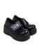 Vintage Black Toxic Skull Platform Shoes: timeless 1950s elegance she makes her own