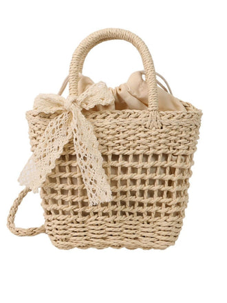 She adds this Vintage Boho Bow Straw Handbag and suddenly it's 1950s perfection