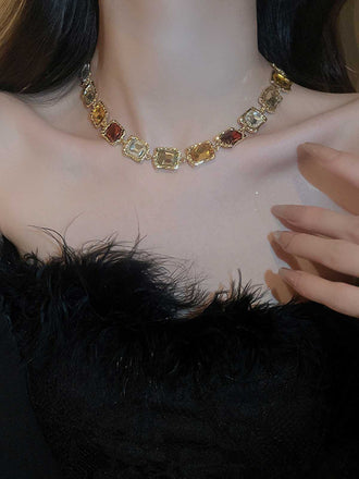 She adds this Vintage Colored Diamond Square Necklace and suddenly it's 1950s perfection
