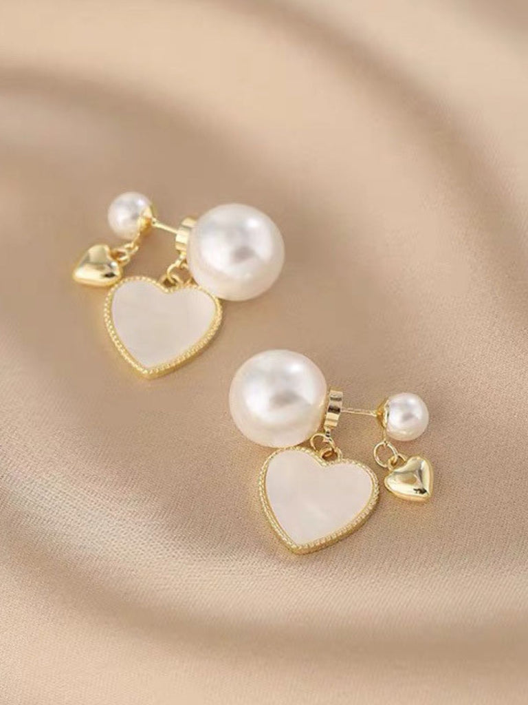 This Vintage Gold Edged Pearl Heart Earrings carries 1950s stories waiting to be told
