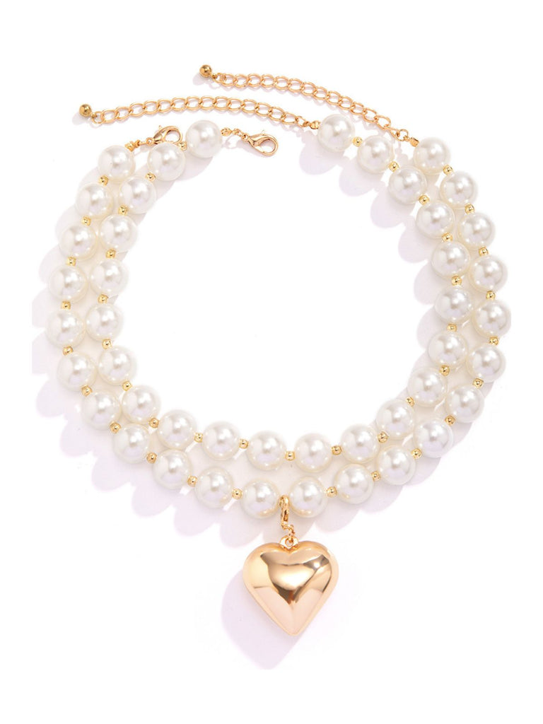 She adds this Vintage Heart Pendant Necklace and suddenly it's 1950s perfection