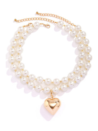 She adds this Vintage Heart Pendant Necklace and suddenly it's 1950s perfection