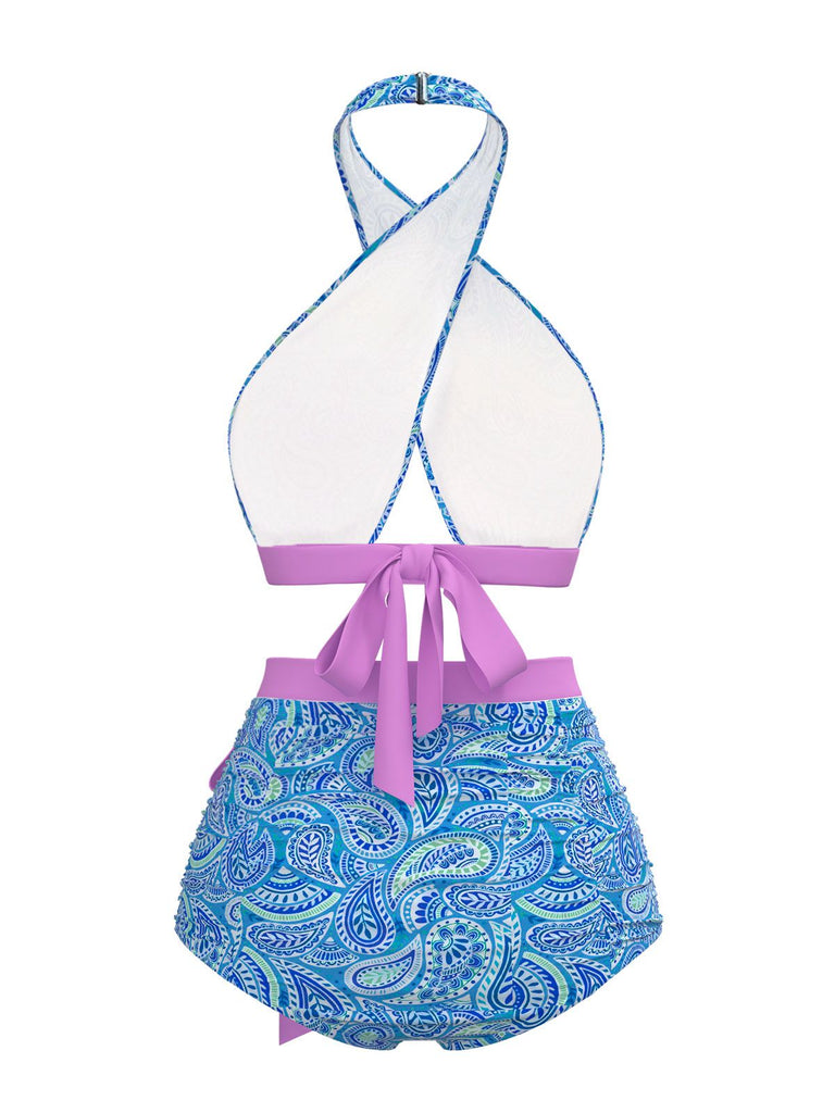 This Violet 1970s Paisley Print Cross-Halter Swimsuit carries 1970s vacation dreams in every stitch