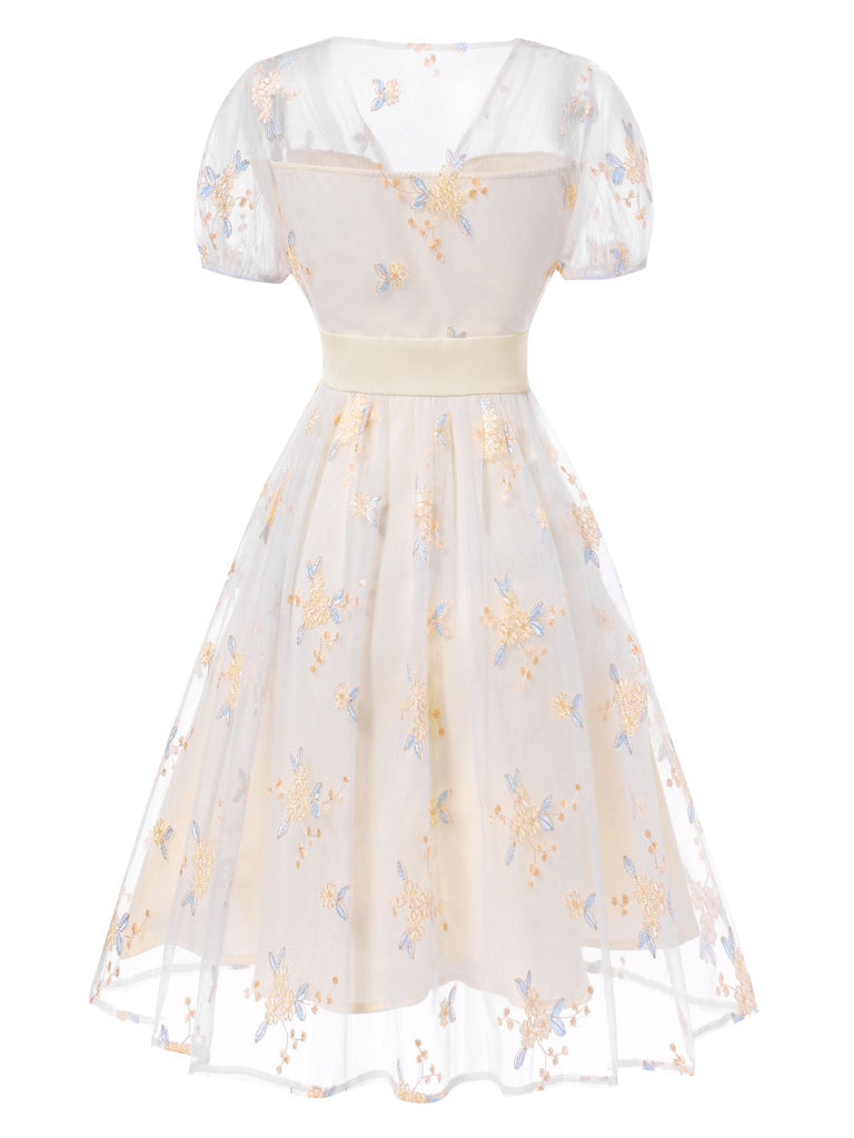 White 1950s Deep V-Neck Embroidered Floral Dress — the kind of 1950s dress that makes strangers smile