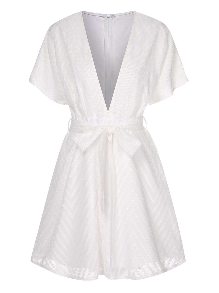She adds this White 1950s Deep V-Neck Textured Belted Romper and suddenly it's 1950s perfection